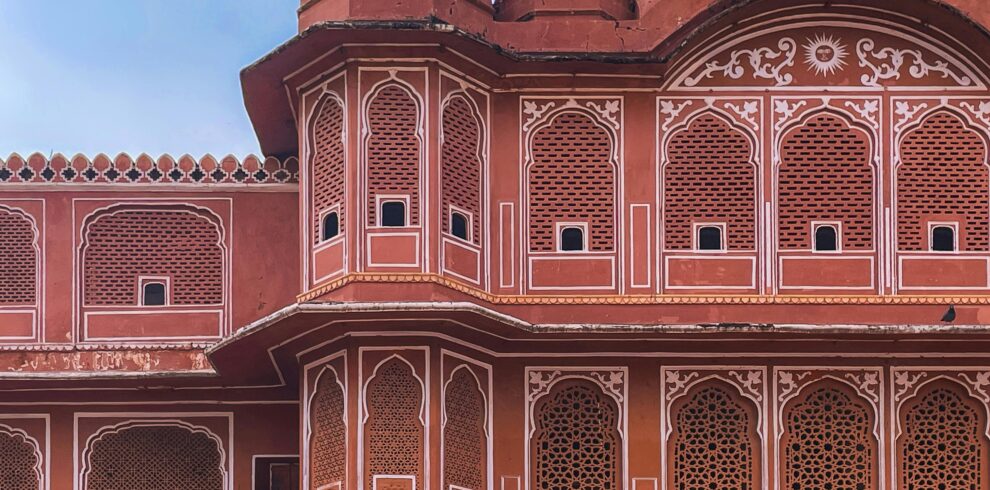 Captivating intricate architectural details of Hawa Mahal, Jaipur in vibrant pink hues.
