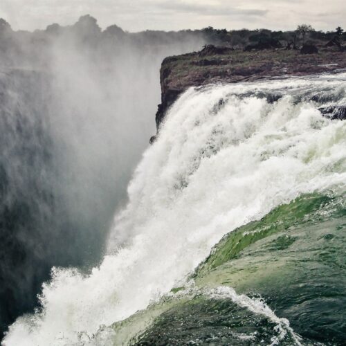 Stunning photo capturing the powerful flow and grandeur of Victoria Falls, Zimbabwe.